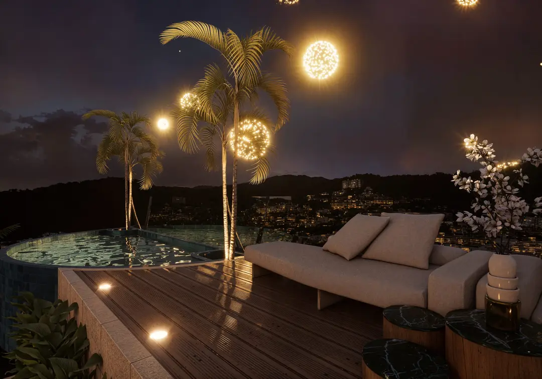 Lounge junto a la alberca con iluminación nocturna