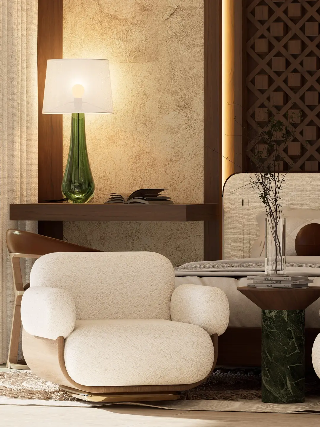 Sillón bouclé junto a la cama y mesa auxiliar de mármol verde